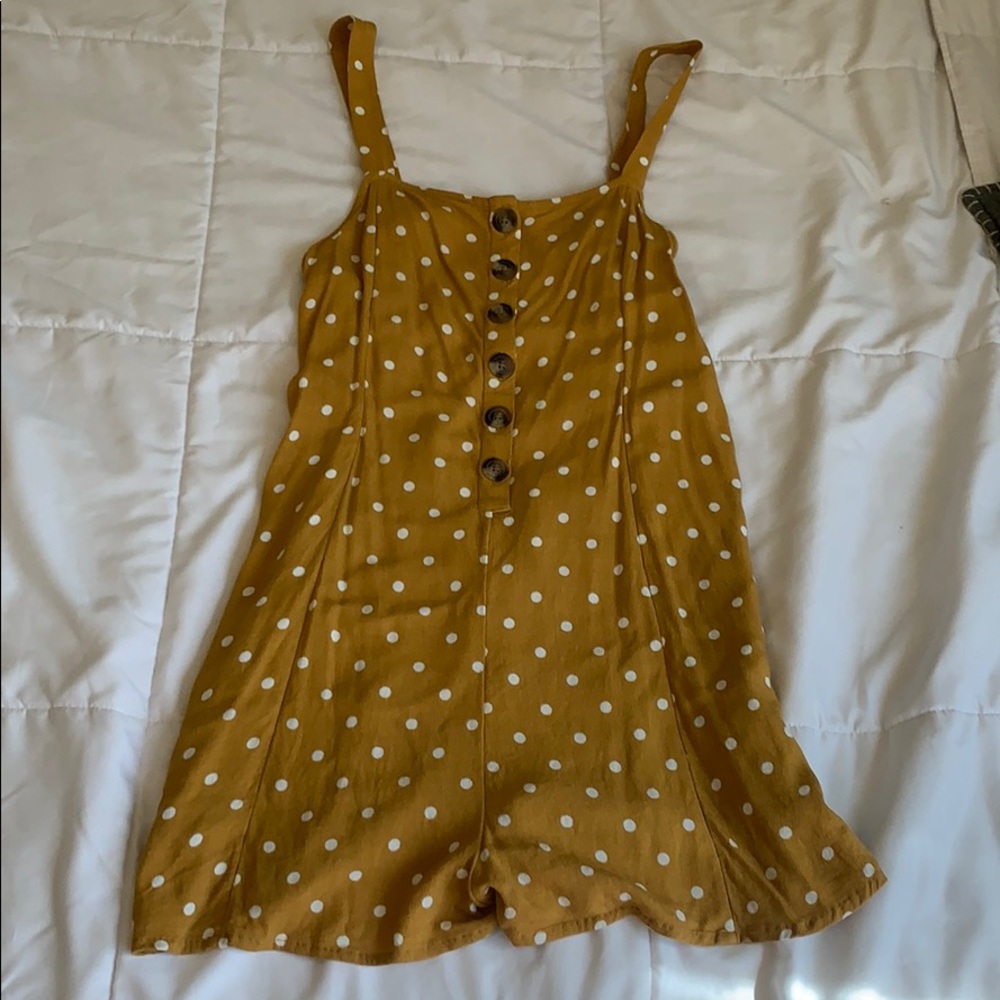 Yellow and white polka dotted romper